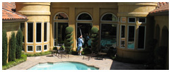 Residential home's windows being cleaned by Paul Black employee.